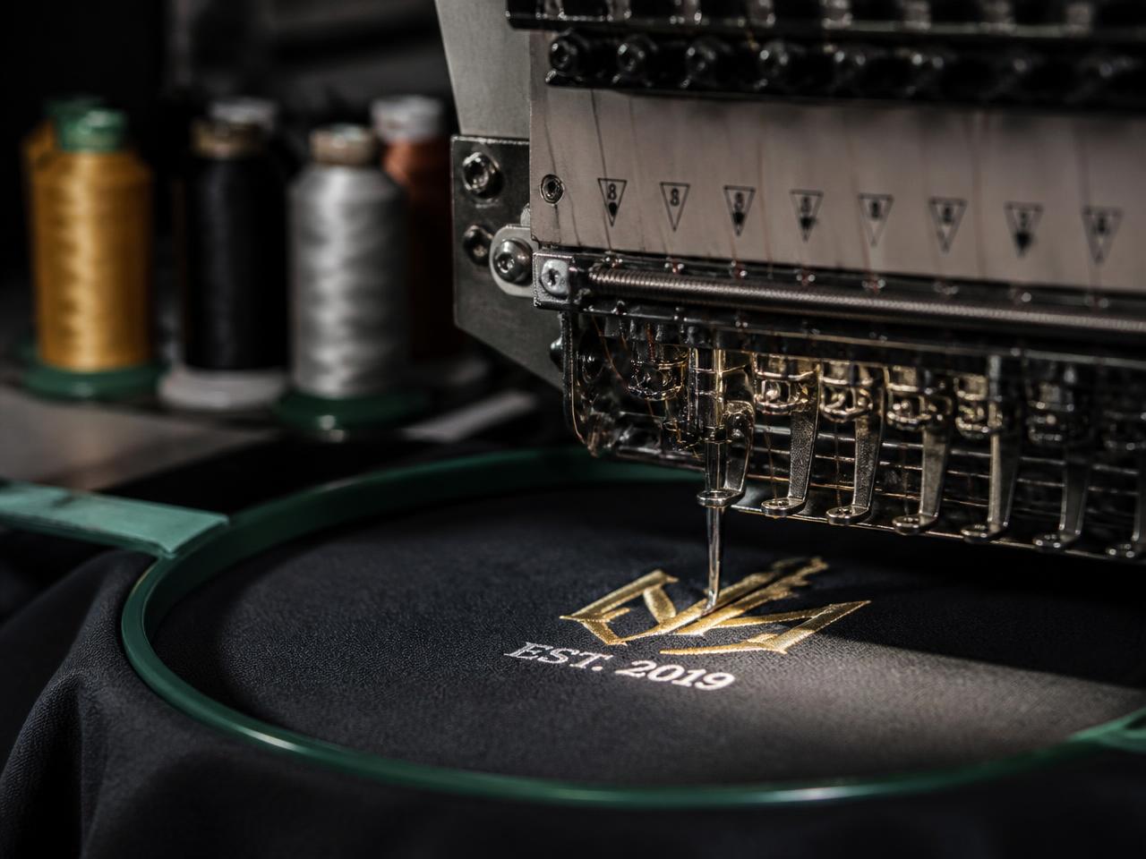 Multi-head embroidery machine running at the EcoWear factory